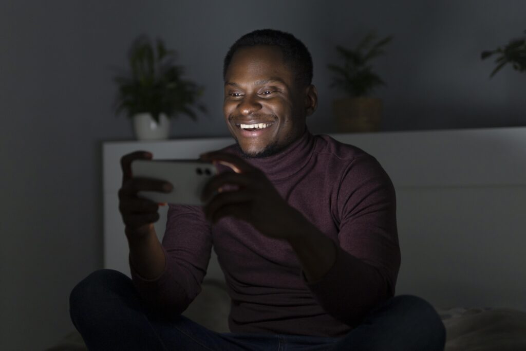 african-american-man-watching-streaming-service-indoors