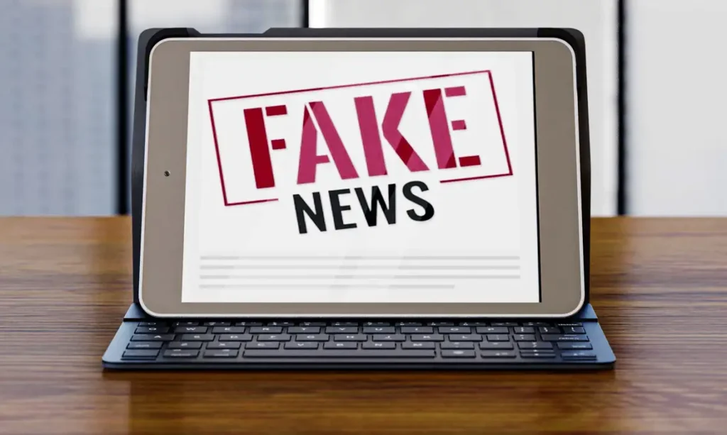 front-view-laptop-desk-with-fake-news_0