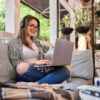 Beautiful student girl learning at home with laptop