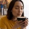 close-up-woman-holding-coffee-cup