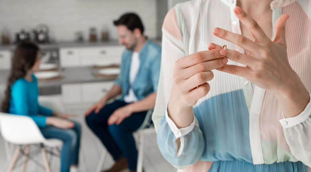 close-up-woman-taking-wedding-ring-off