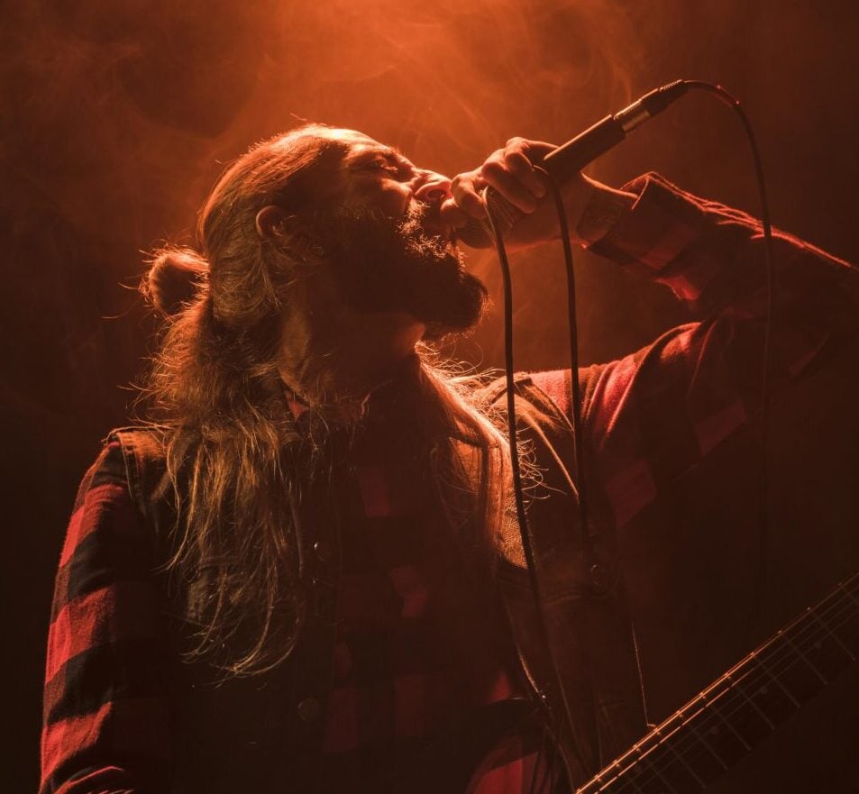 long-hair-guitar-guy-singing-low-view (1)